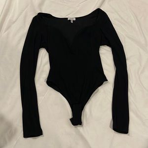 Black body suit kinda low cut